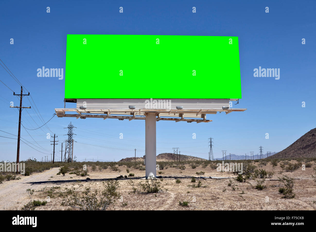 Green chroma key billboard in the middle of California's Mojave desert. Stock Photo