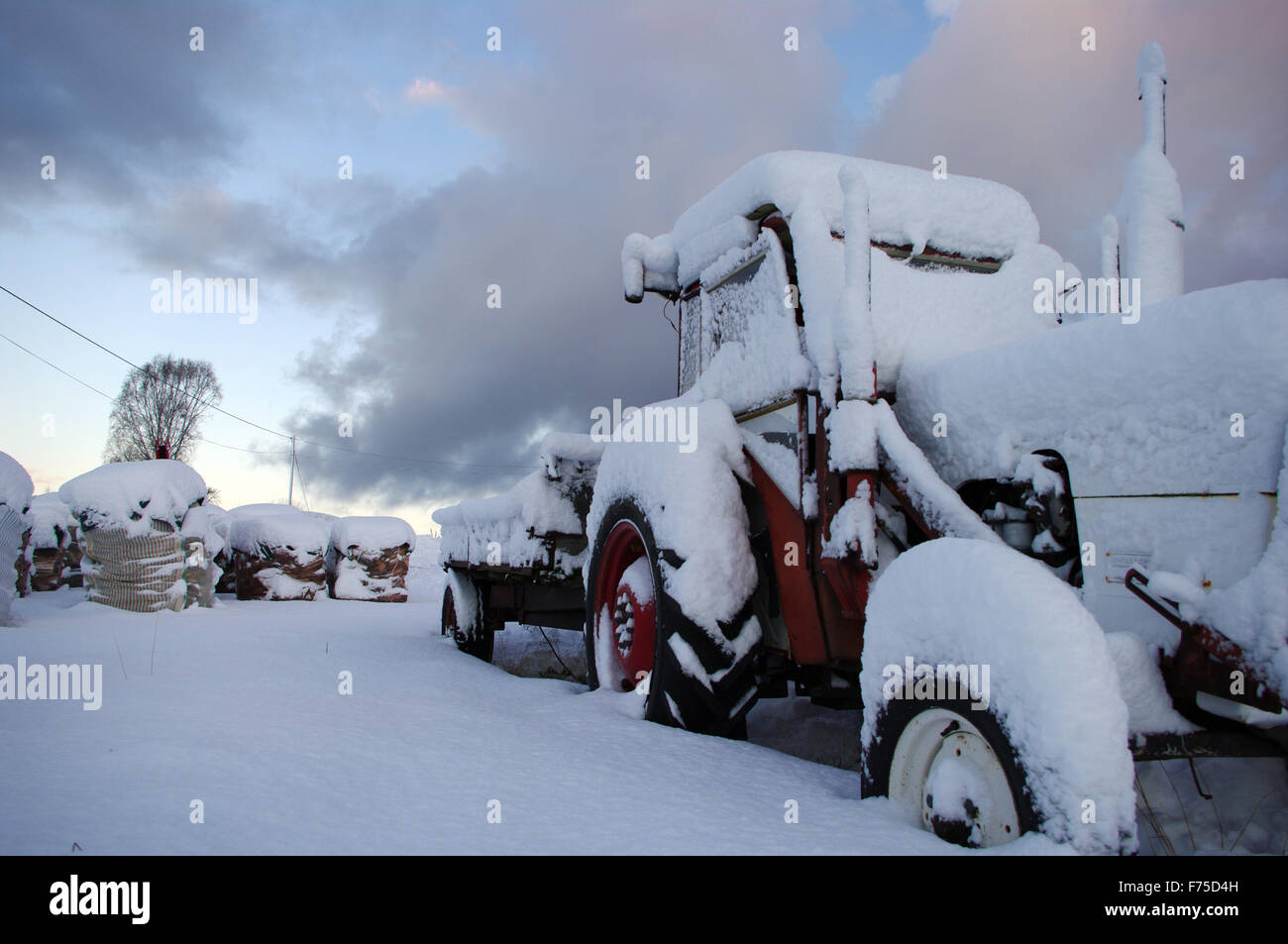 Tractor in the snow Stock Photo
