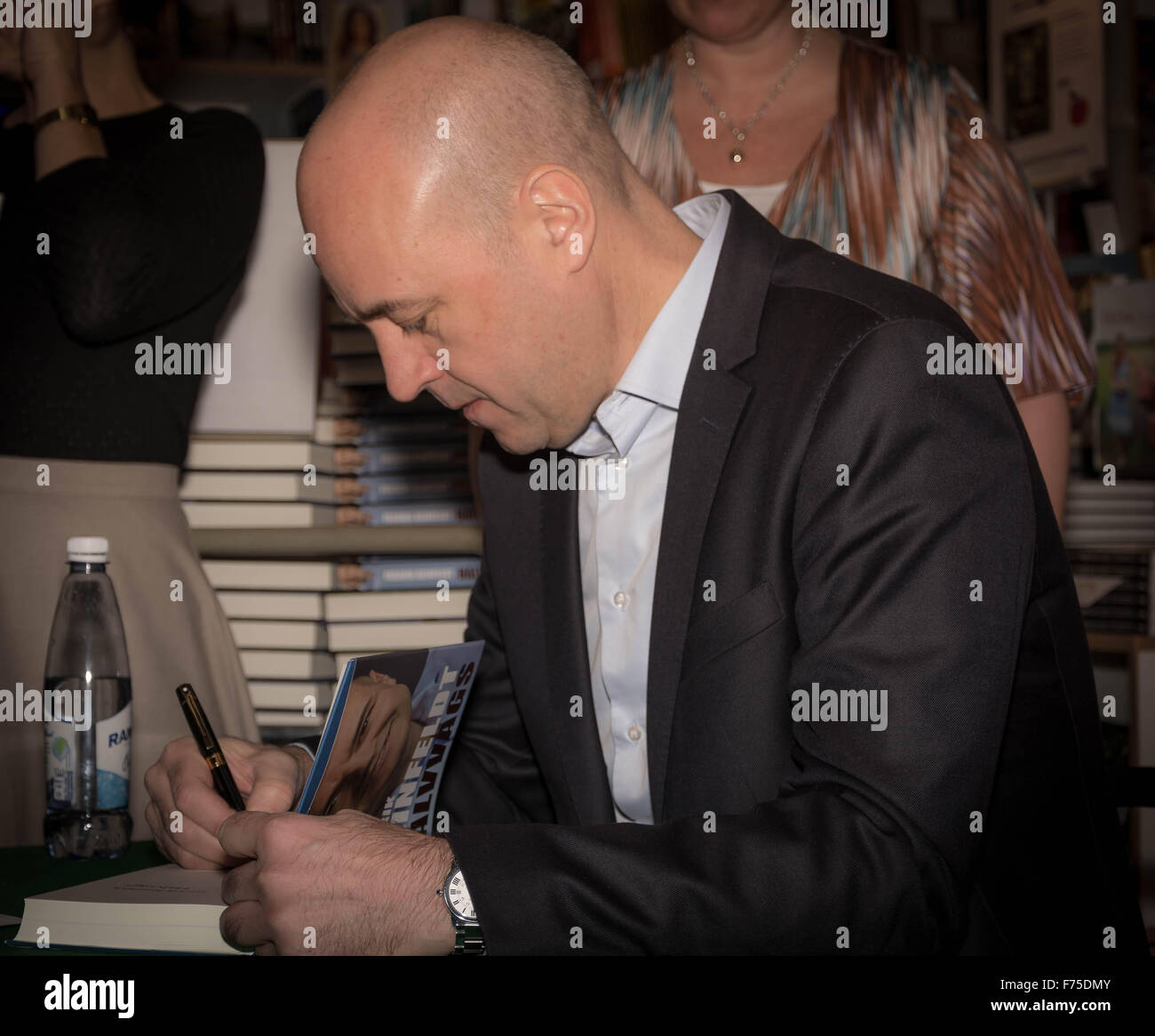 Malmo, Sweden. 25th Nov, 2015. Fredrik Reinfeldt signing his book