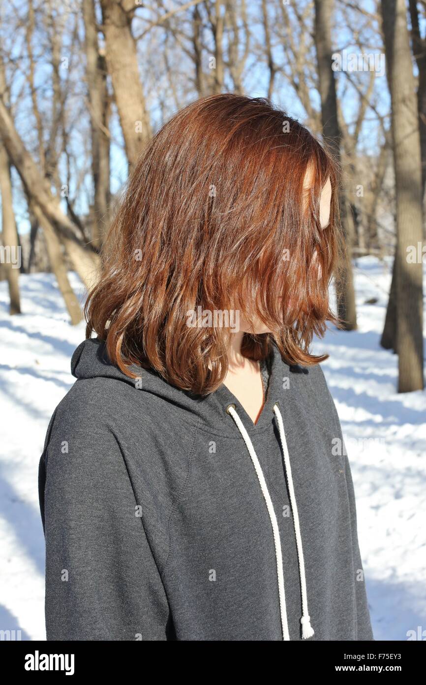A teenage girl with hair in her face Stock Photo - Alamy