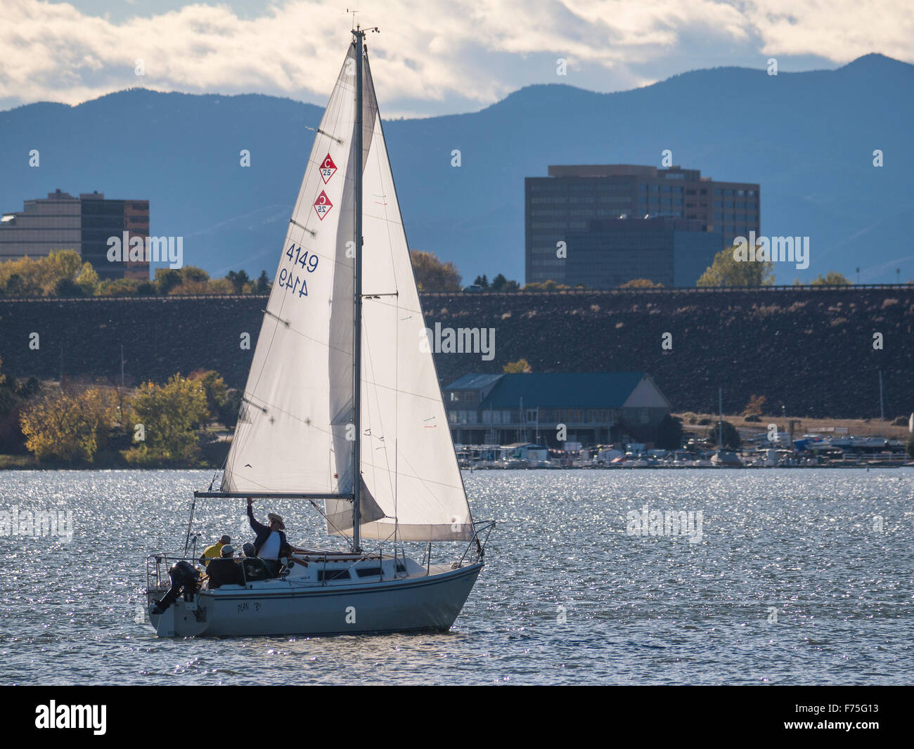 Sailboat sails Cherry Creek Reservoir, autumn, Aurora, Colorado. Stock Photo