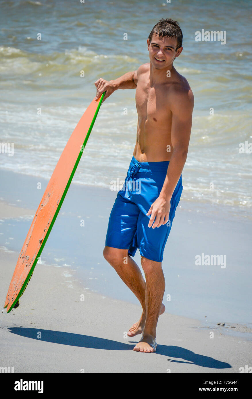 Teenage boy in swim trunks hi-res stock photography and images - Alamy