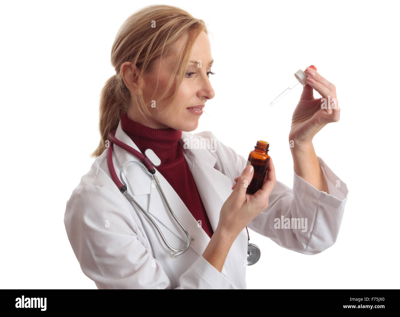 Doctor naturapath with eyedropper and  bottle Stock Photo