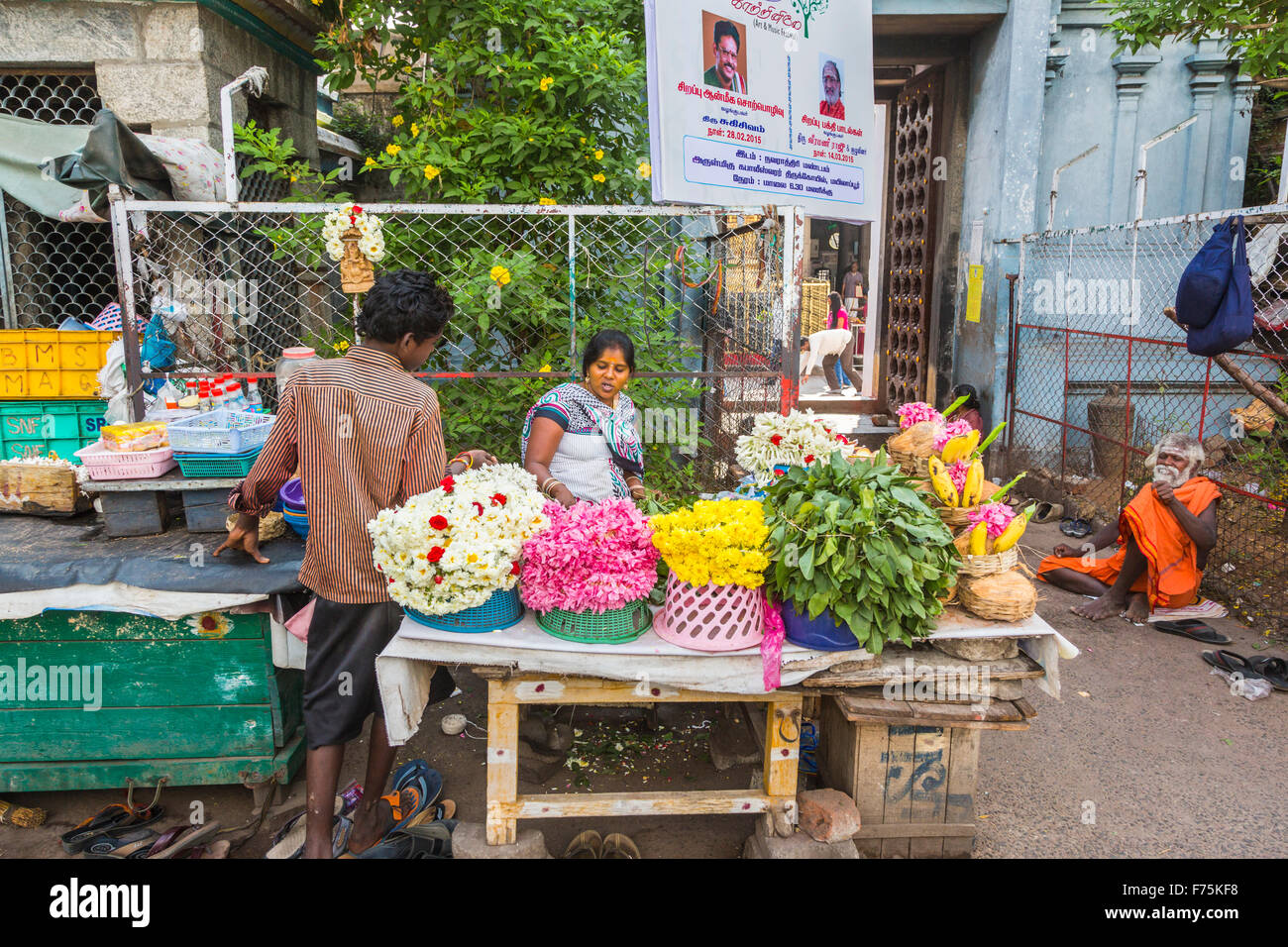Flower seller selling flowers for offerings outside Kapaleeswarar