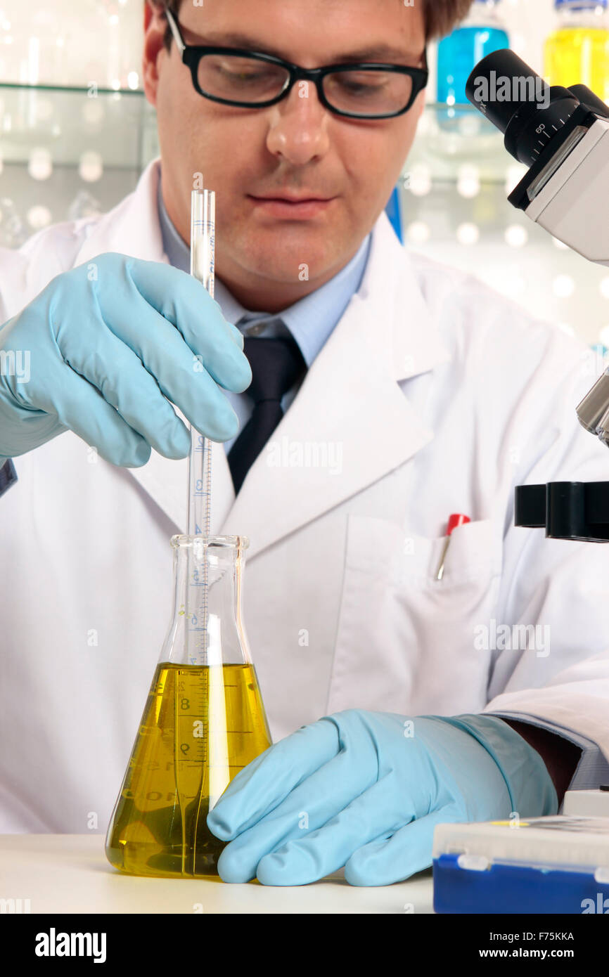 Scientist mixing liquids chemicals Stock Photo Alamy