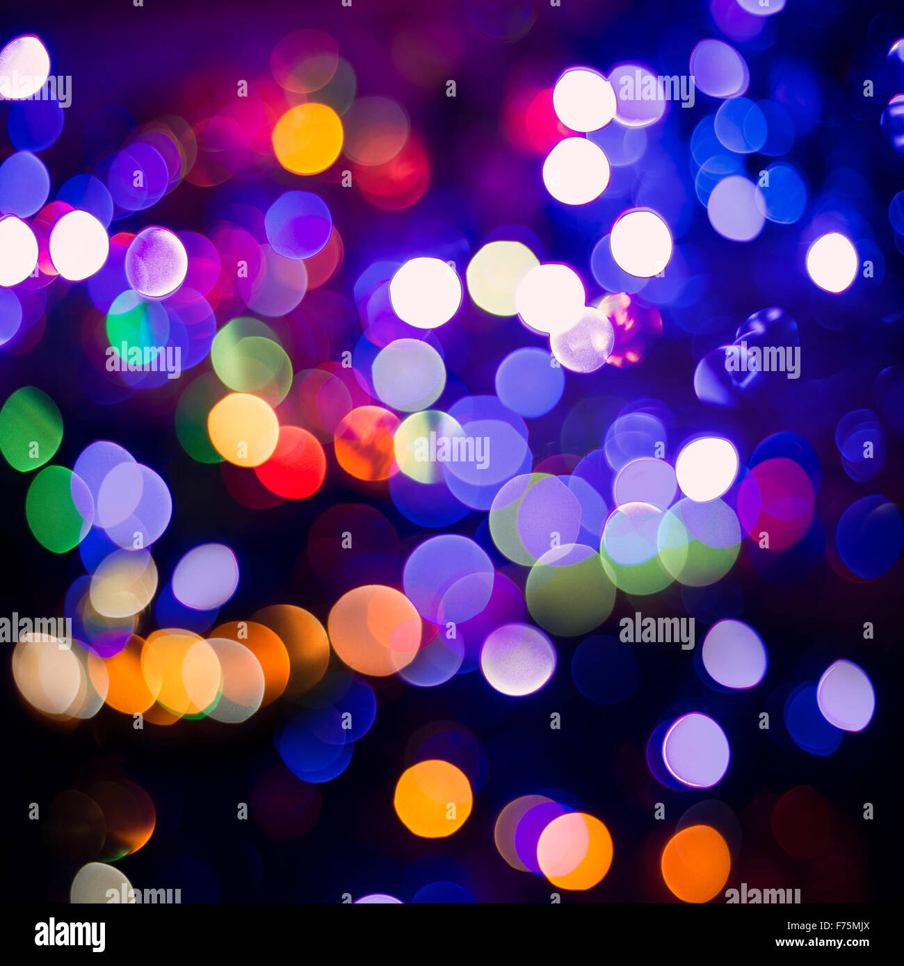 Night celebration, colorful blur light abstract background. Ideal for holiday greeting card, party invitation or web backdrop. Stock Photo