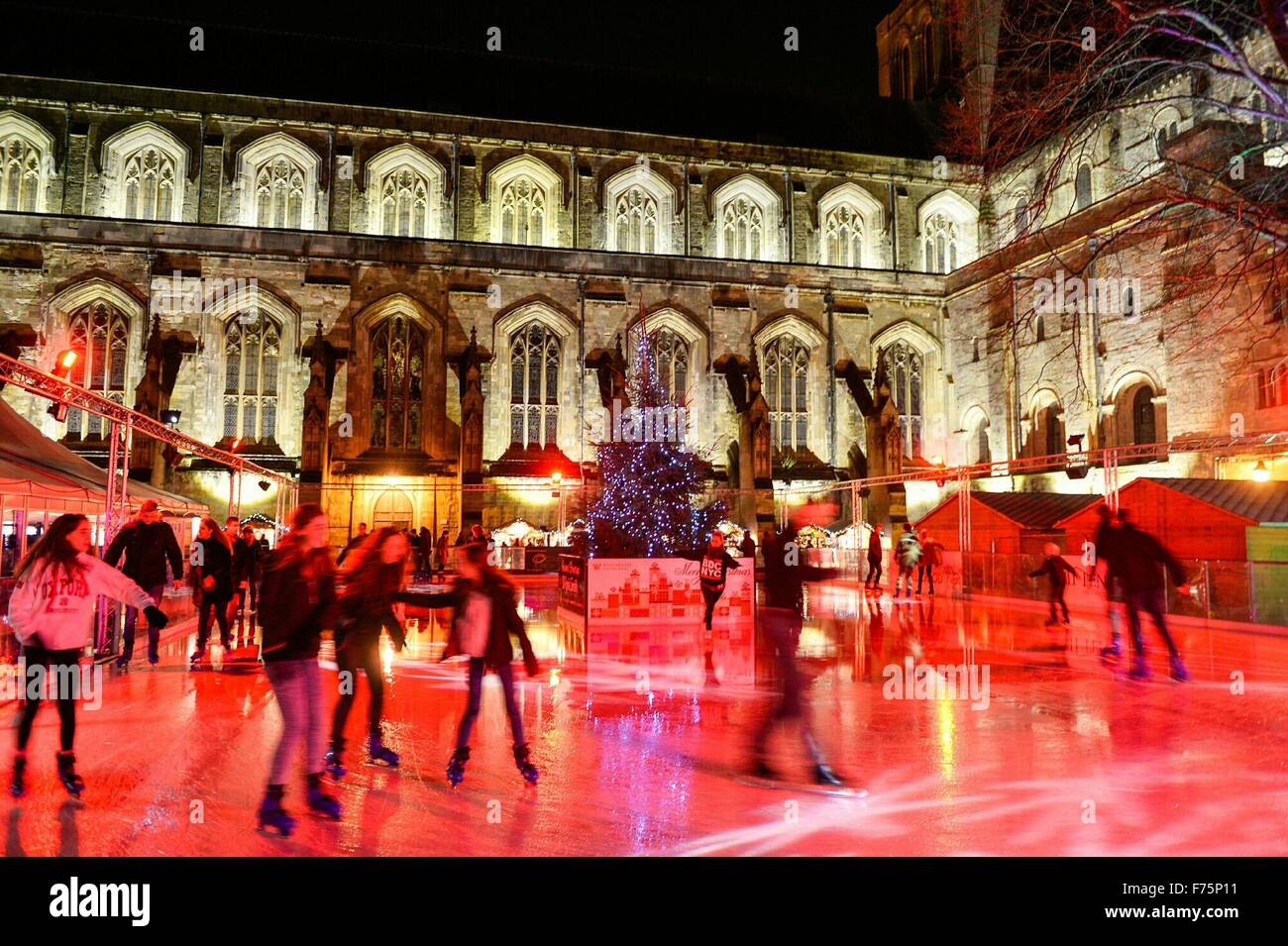 Winchester, Hampshire, UK. 25th Nov, 2015. Skaters on the Ice Skating Rink in the grounds of Winchester Cathedral, Winchester, Hampshire UK where the annual Christmas Market is held: 25 November 2015. Credit:  STUART WALKER/Alamy Live News Stock Photo