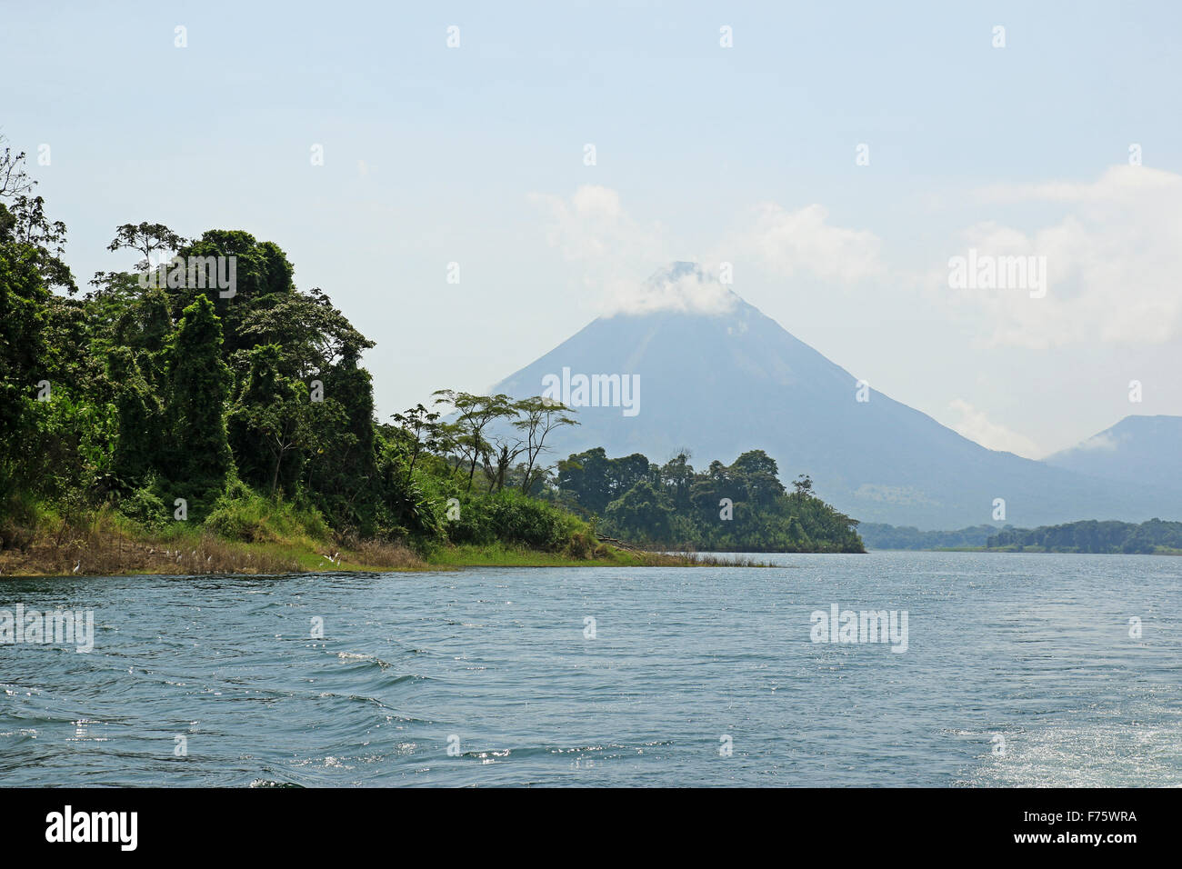 Arenal volcano viewed from Lake Arenal in La Fortuna, Costa Rica Stock Photo