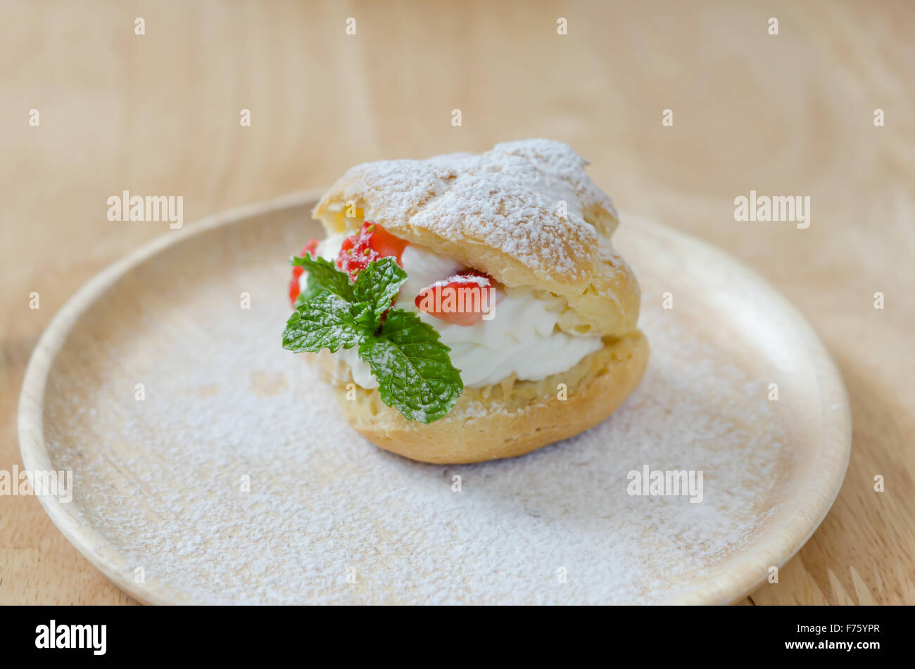 fresh strawberry Choux Cream on wooden dish Stock Photo