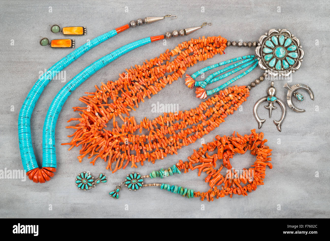 A collection of Vintage Native American Jewelry made of turquoise, silver and branch coral. Stock Photo
