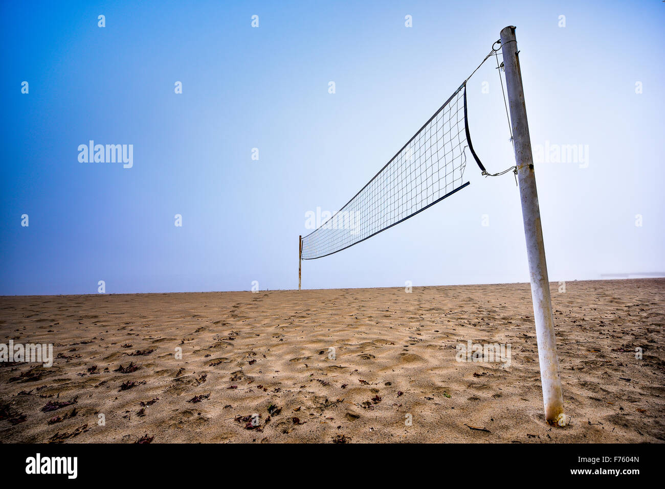 Volleyball net on a beach in thick fog on the Ottawa River Stock Photo