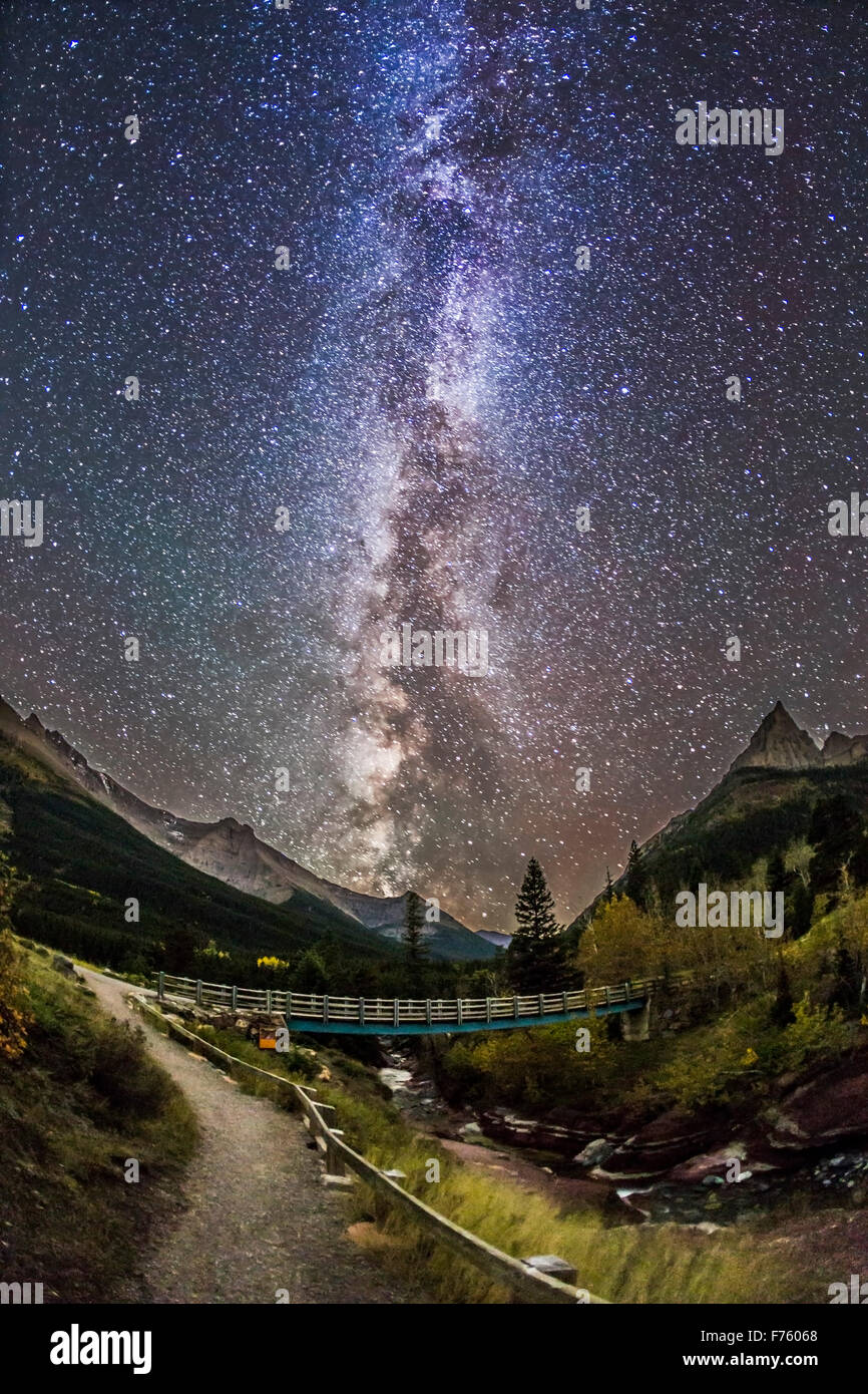Red Rock Canyon in Waterton Lakes National Park, with the Milky Way, and with the landscape illuminated only by starlight.   Thi Stock Photo
