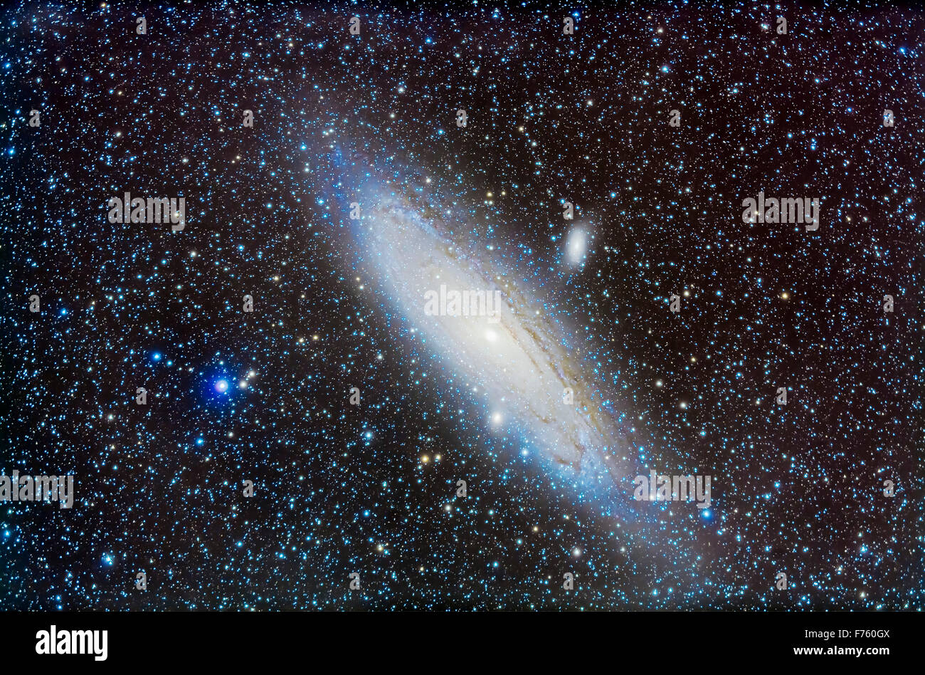 M31, the Andromeda Galaxy, with companions, M32 below and M110 above. This is a stack of 15 x 7 minute exposures to go fairly de Stock Photo