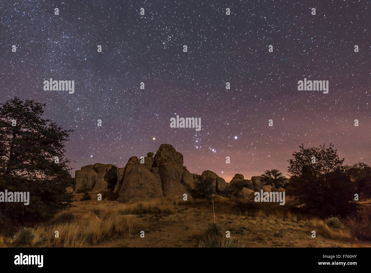 Orion rising at the City of Rocks State Park, New Mexico, on Christmas Eve, 2014. with light from the waxing crescent Moon provi Stock Photo