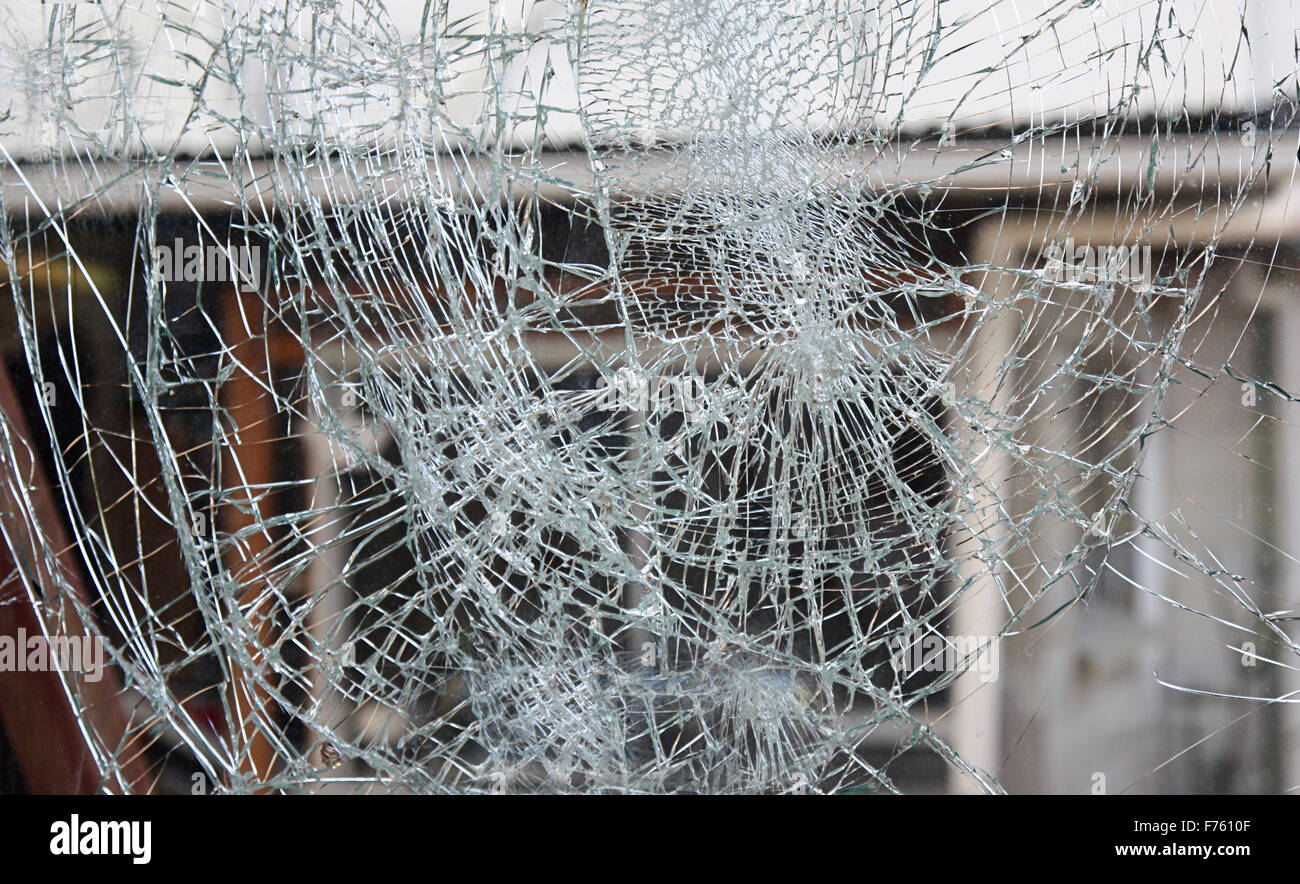 broken glass or pane with a house in background Stock Photo