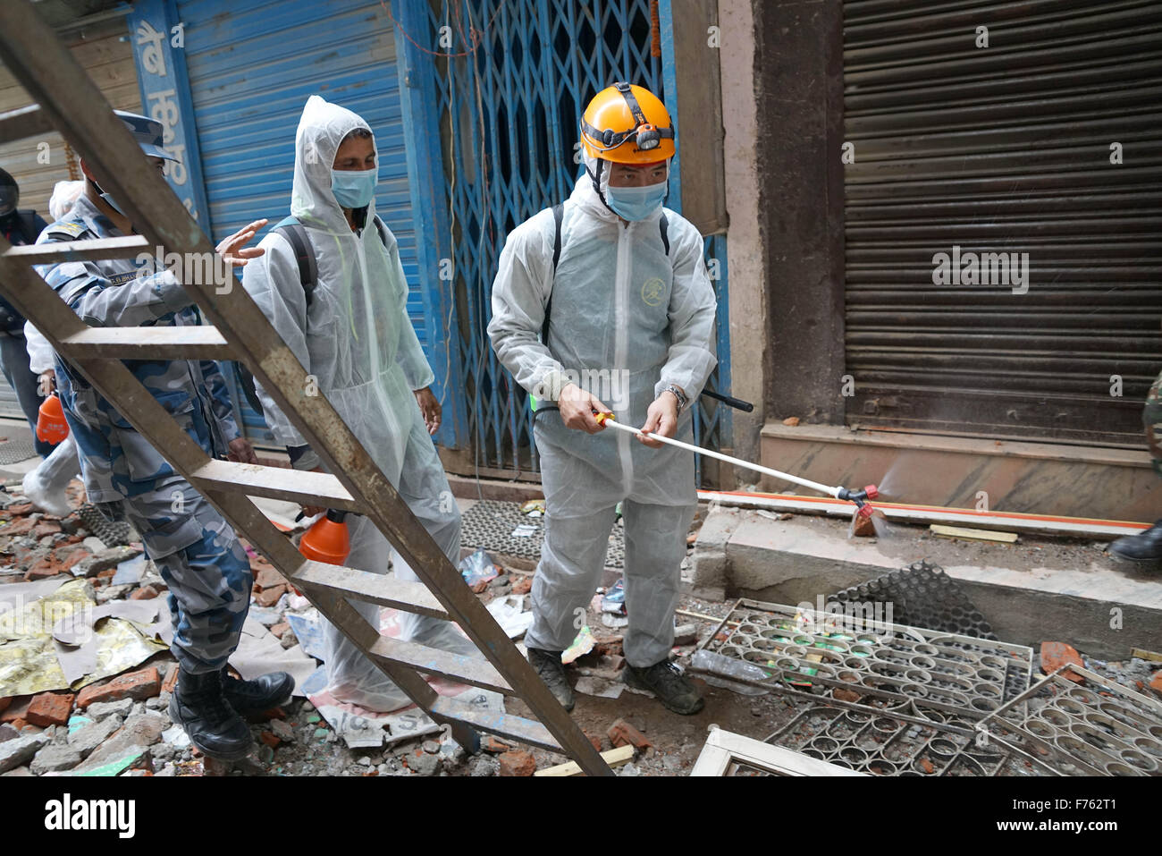Rescue personnel spray disinfectant, earthquake, nepal, asia Stock Photo