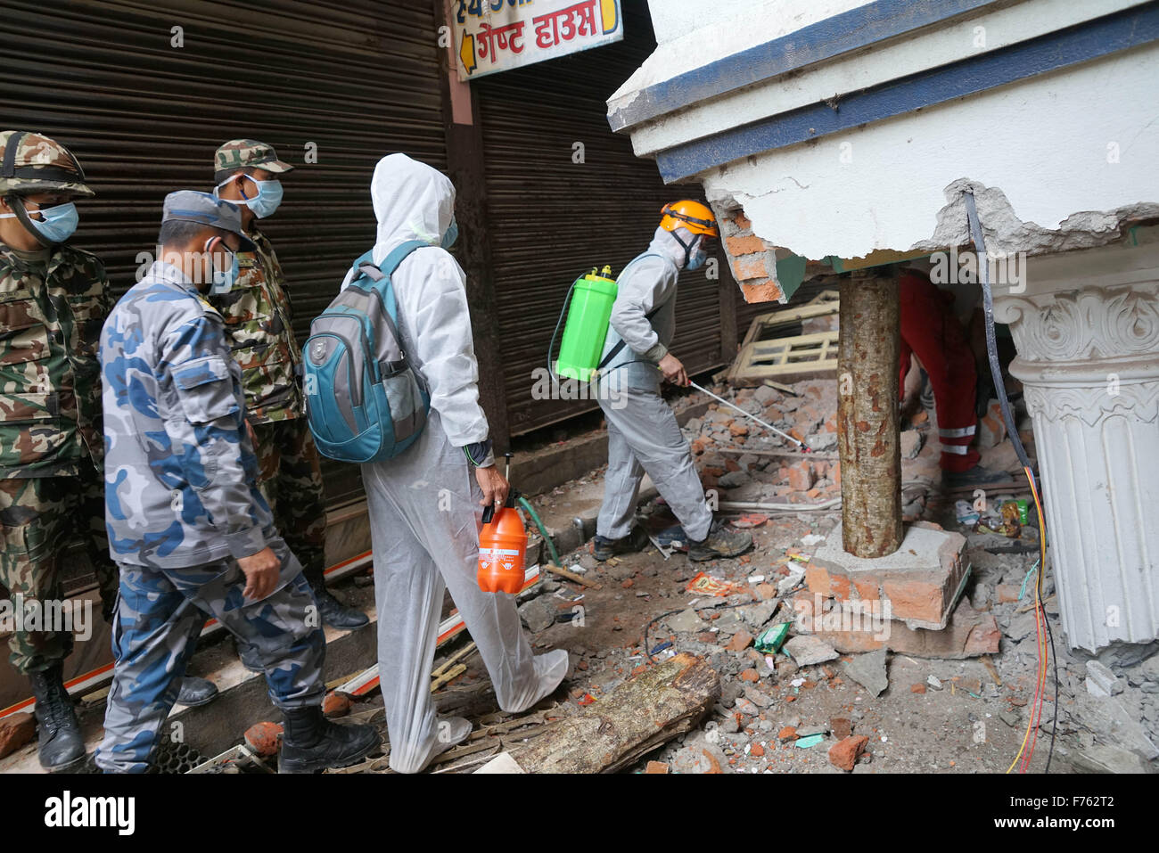 Rescue personnel spray disinfectant, earthquake, nepal, asia Stock