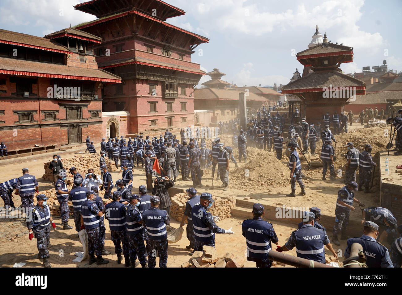 Police personnel clearing debris, krishna temple, nepal, asia Stock Photo