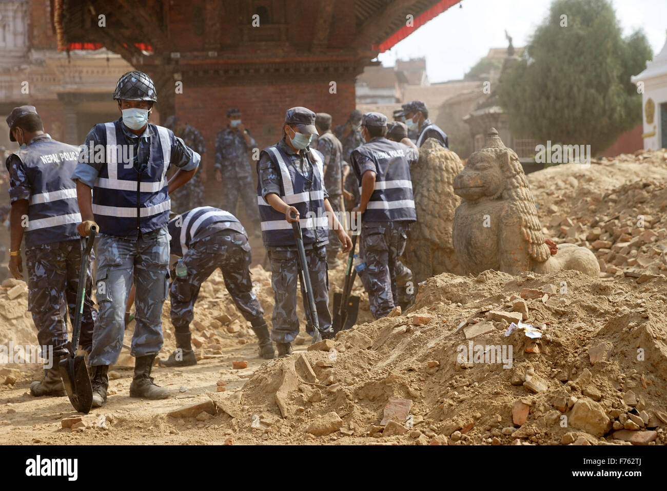 Police personnel clearing debris, krishna temple, nepal, asia Stock Photo