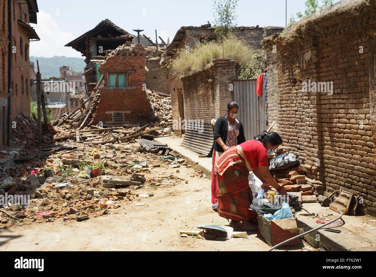 Residents retrieve belongings from collapsed homes, earthquake, nepal, asia Stock Photo