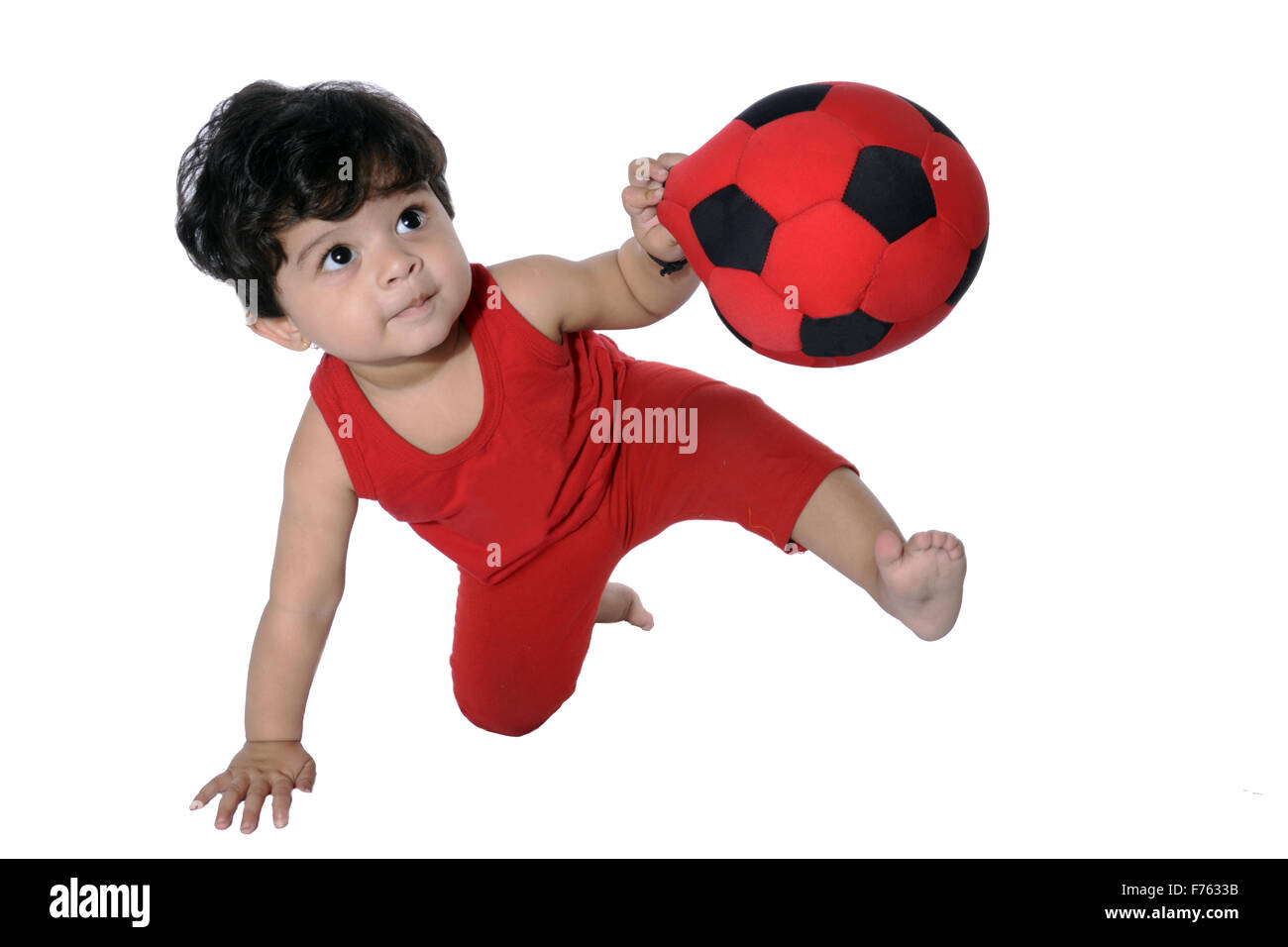 Baby boy playing with ball Stock Photo