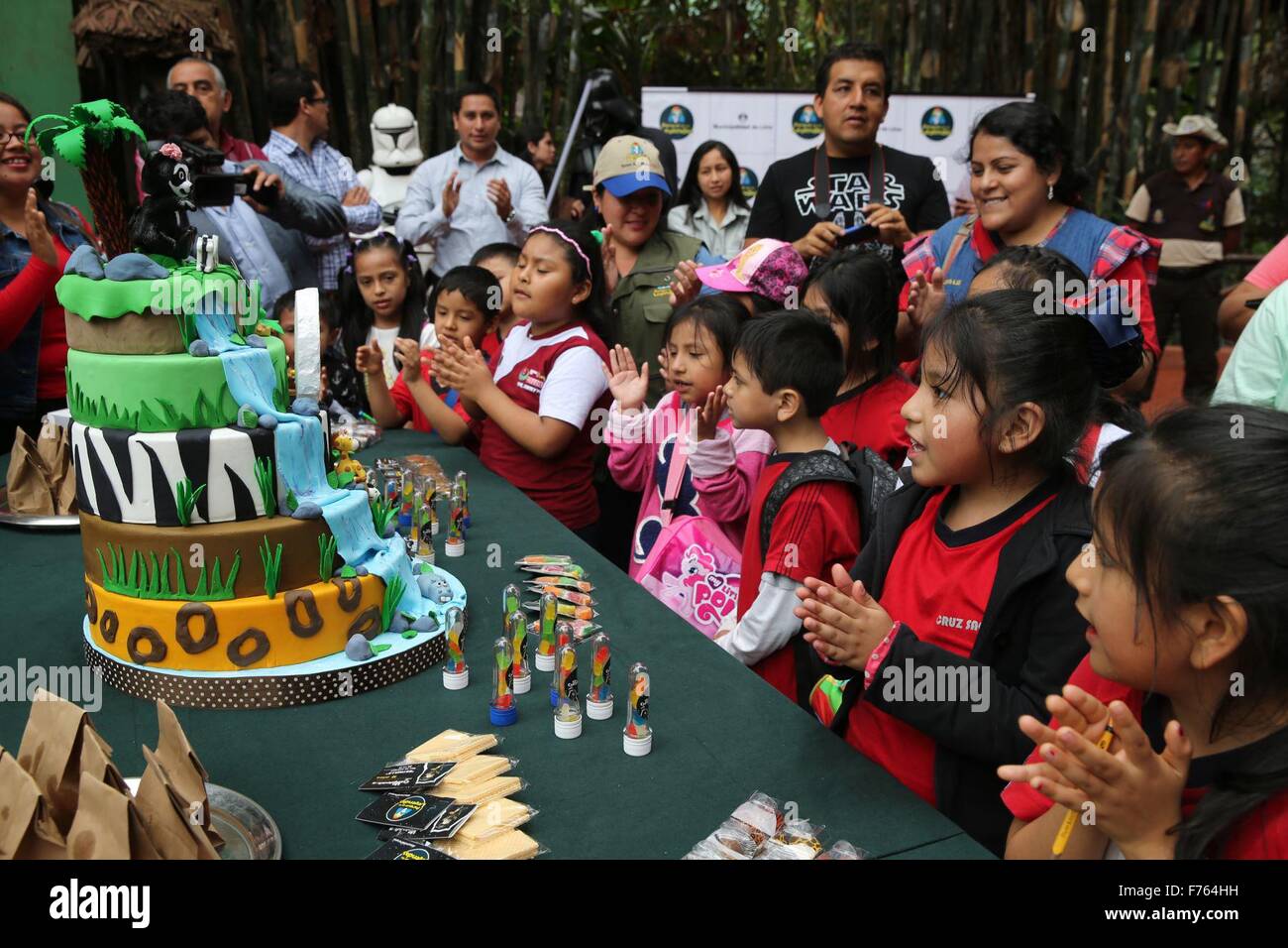 Lima, Peru. 25th Nov, 2015. Children take part in the celebration of the 16th birthday of the bear 'Star', a female bear of the species Spectacled bear, at the Park of the Legends, in Lima, Peru, on Nov. 25, 2015. Credit:  Norman Cordova/ANDINA/Xinhua/Alamy Live News Stock Photo