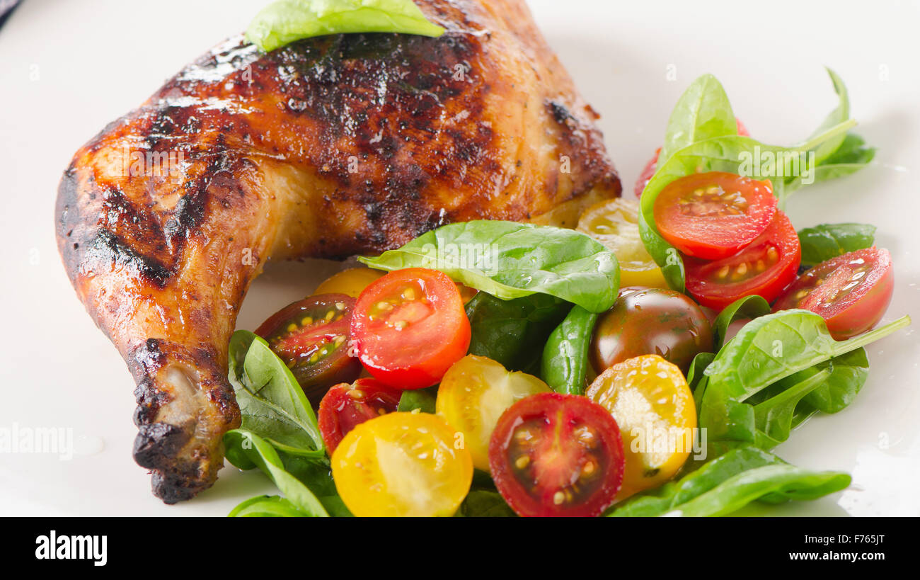 Roasted chicken leg with fresh vegetables Stock Photo Alamy