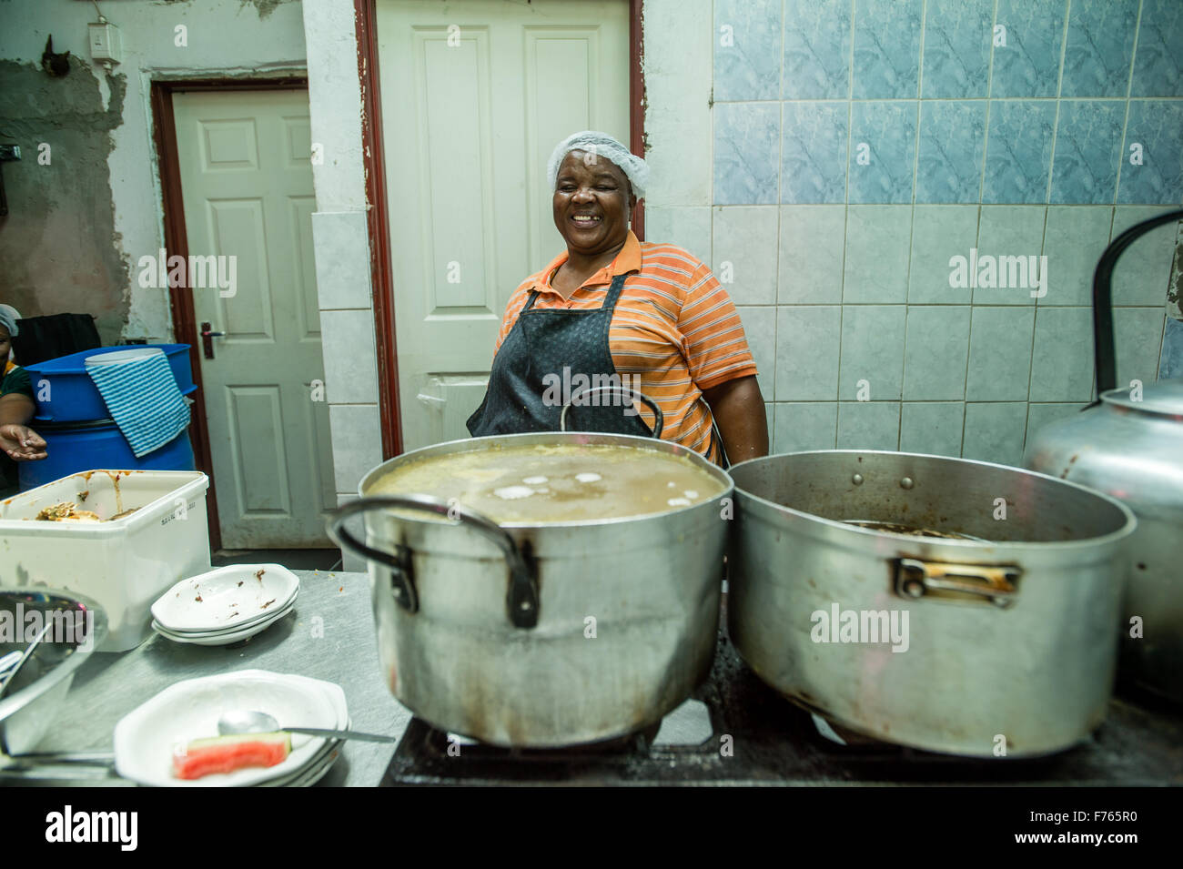 SOWETO, SOUTH AFRICA- Woman at the Chez Alina Restaurant Stock Photo