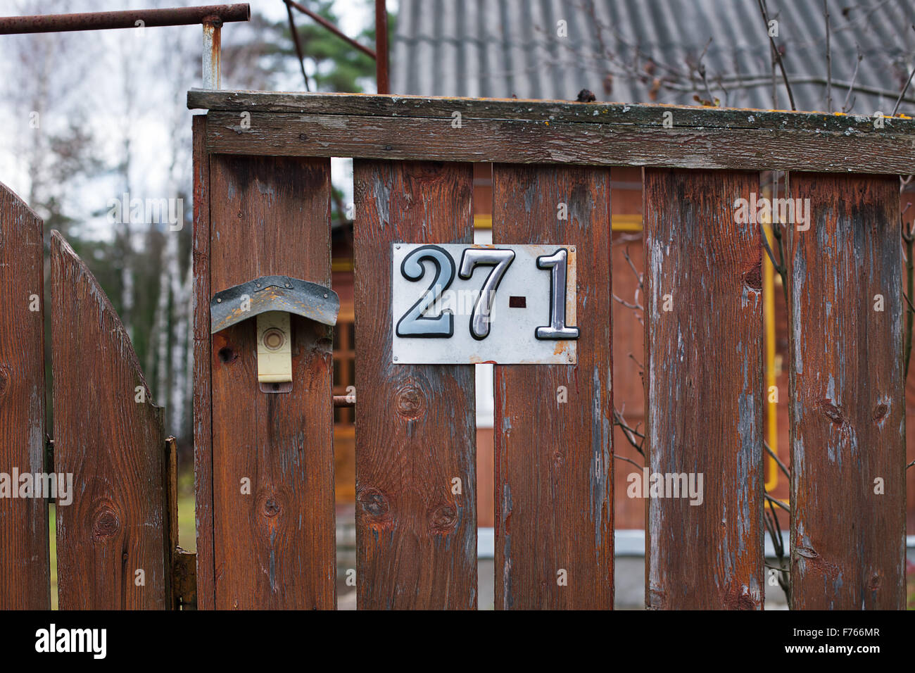 Number of rural house attached to brown fence Stock Photo Alamy