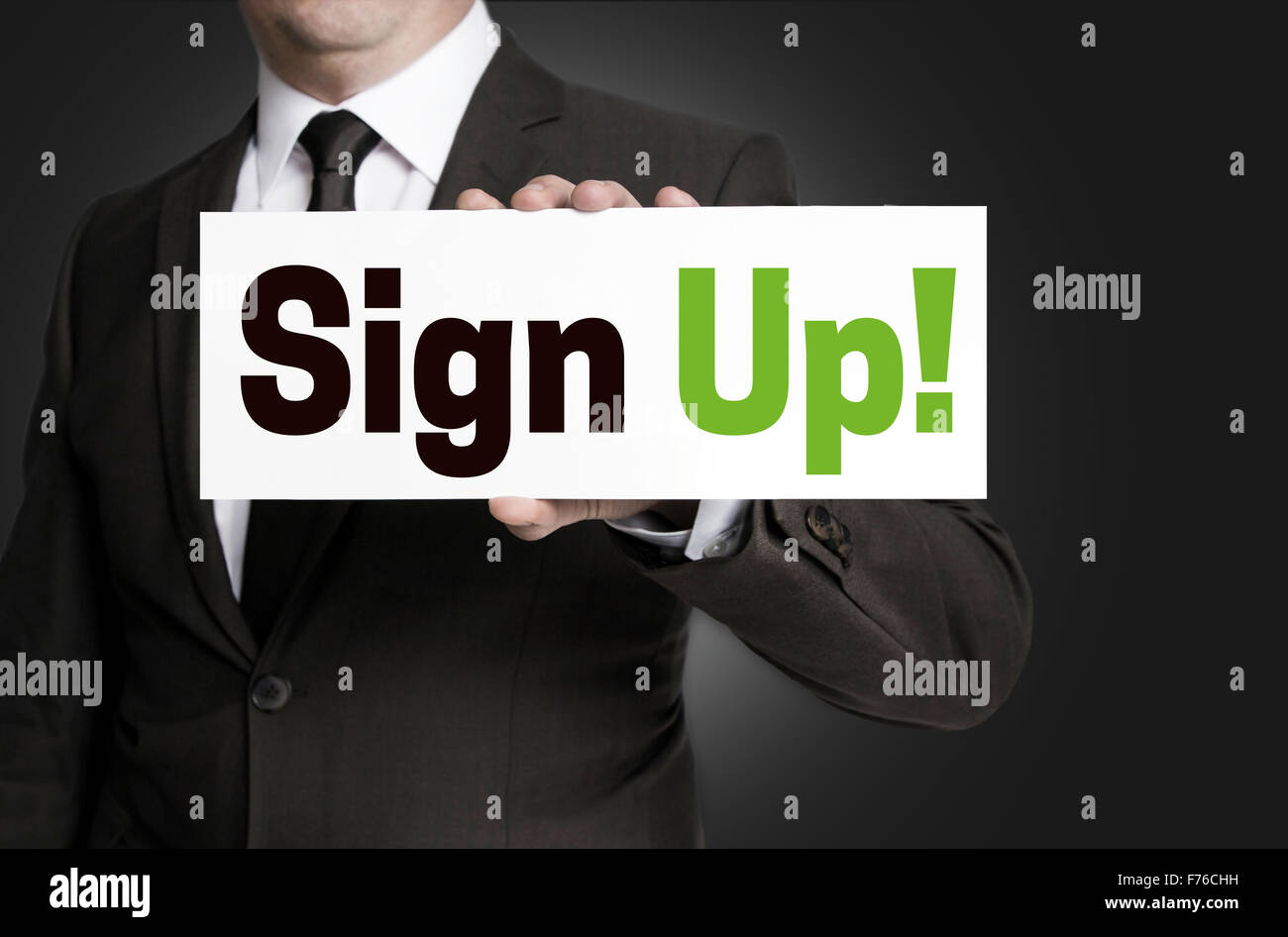 sign up plate held by businessman concept. Stock Photo