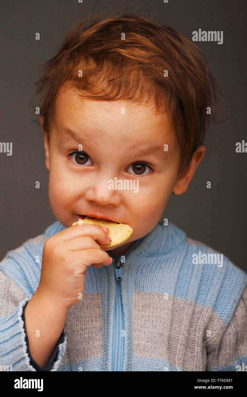 Boy with a cookie Stock Photo Alamy