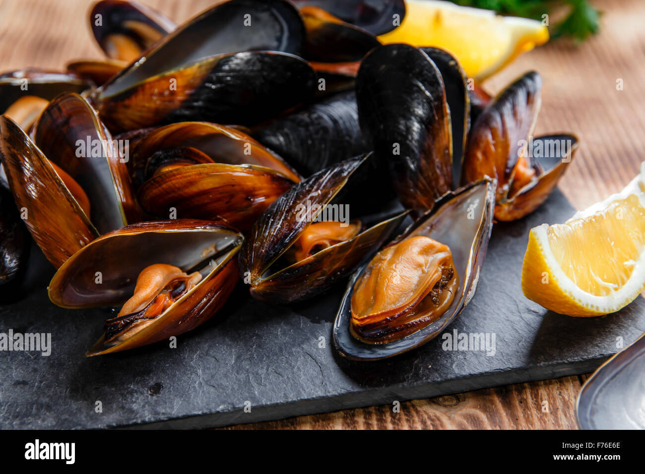 mussels steamed oysters with lemon and herbs Stock Photo Alamy