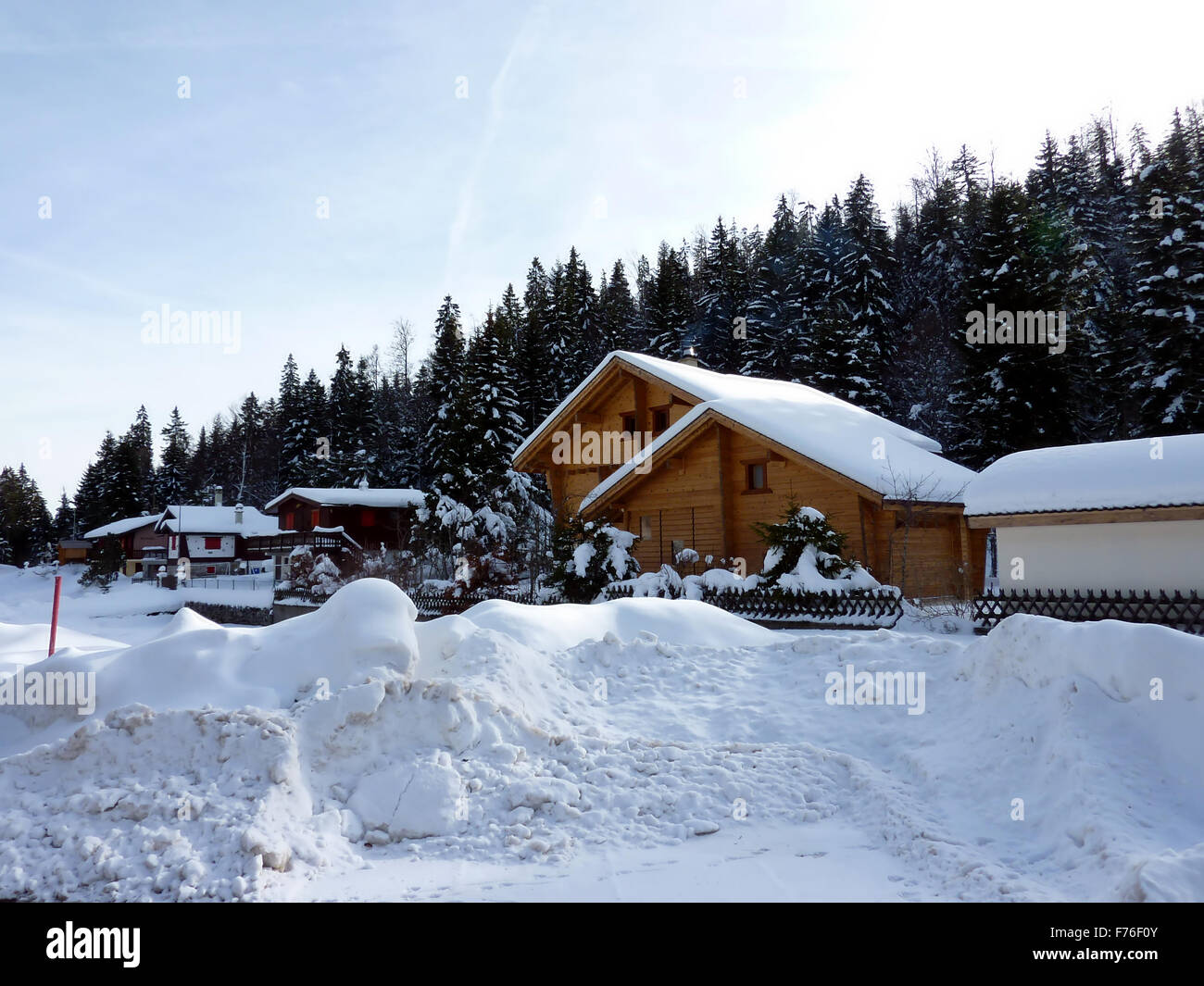Chalets in Switzerland mountain by winter Stock Photo - Alamy