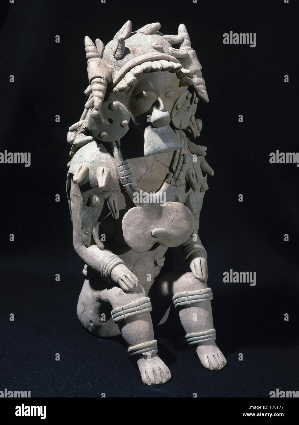 Pre-Columbian art. The Ancient Jama-Coaque Culture. Northern coast of Ecuador. 500 BC-500 AD 'Chone type'. Male figure sitting. 39 x 19 cm. Private collection. Stock Photo