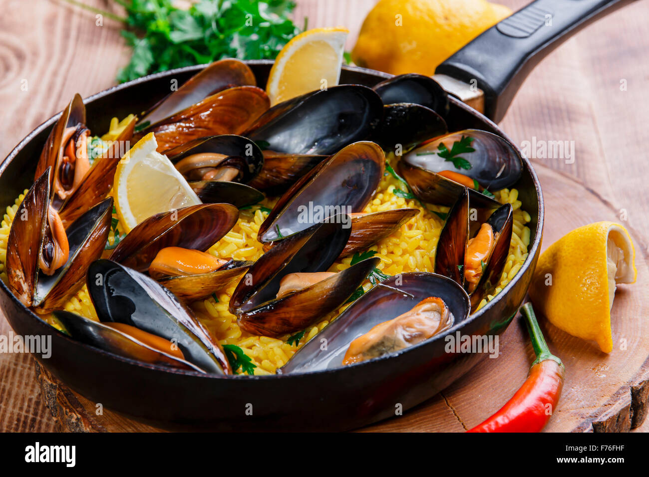 mussel paella rice in a frying pan Stock Photo