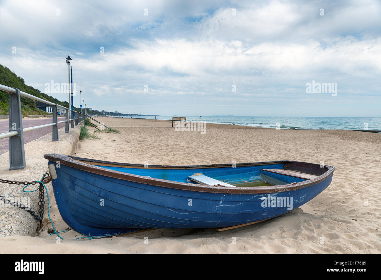 A rowing boat on the beach at Bournemouth on the Dorset coast Stock Photo