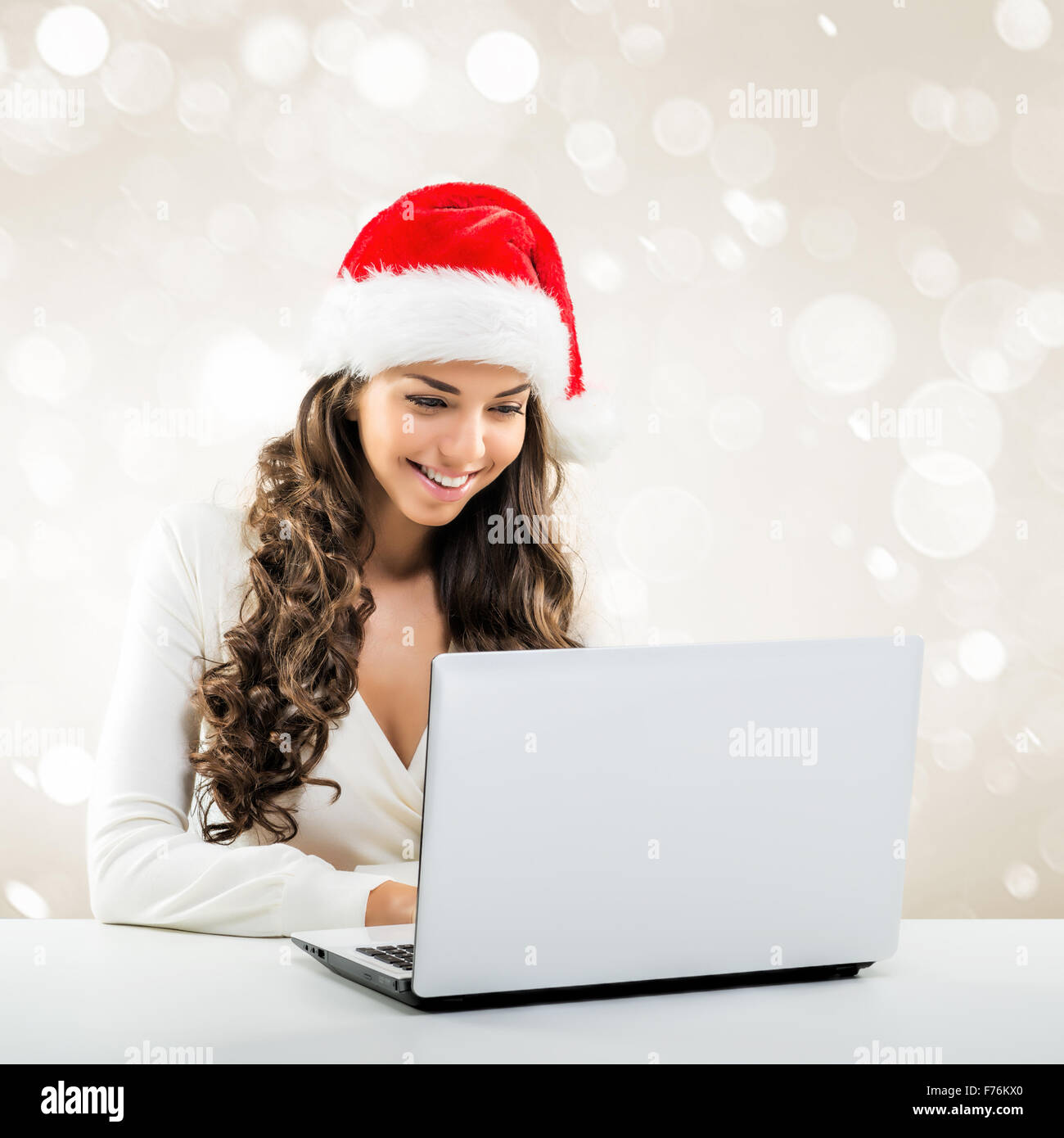 Business woman in Santa Claus hat Stock Photo