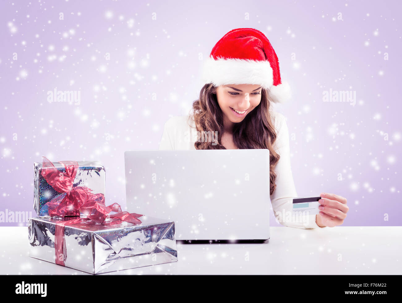 Business woman  working in Santa Claus hat Stock Photo