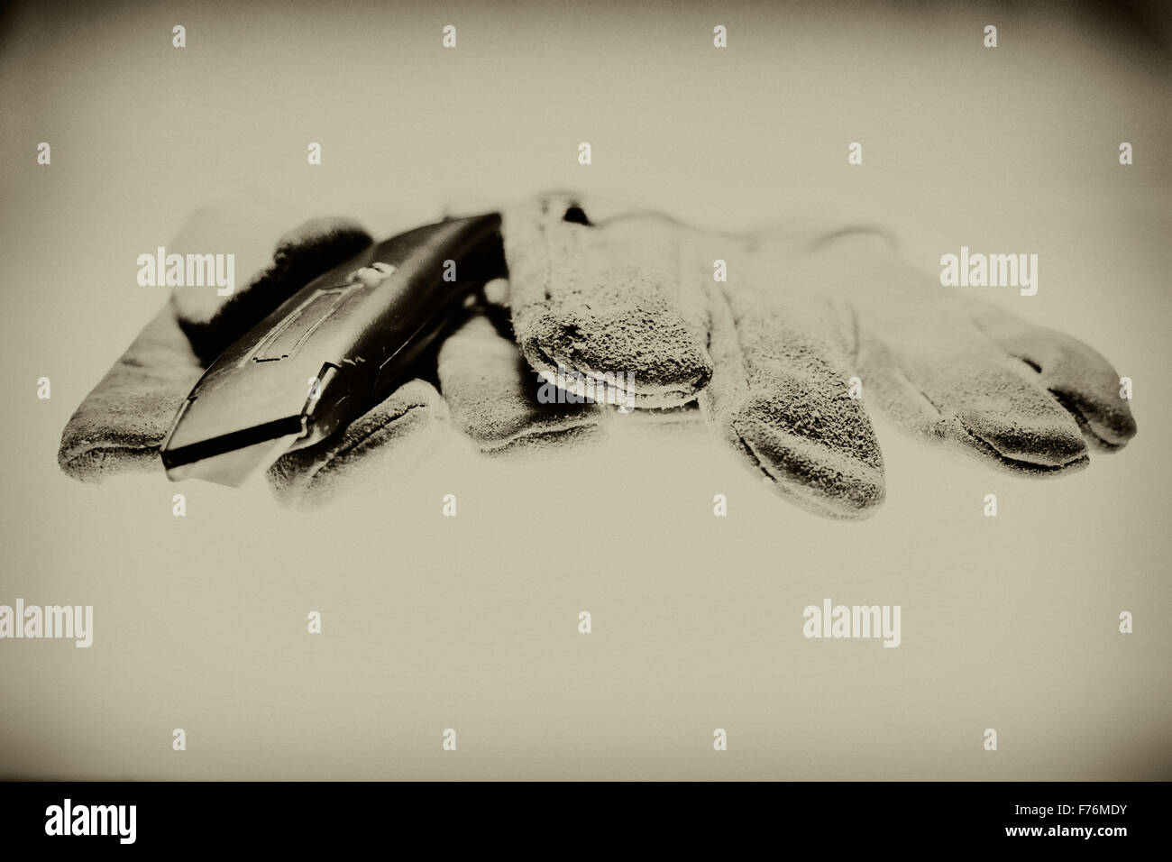 Gloves and a utility knife Stock Photo Alamy