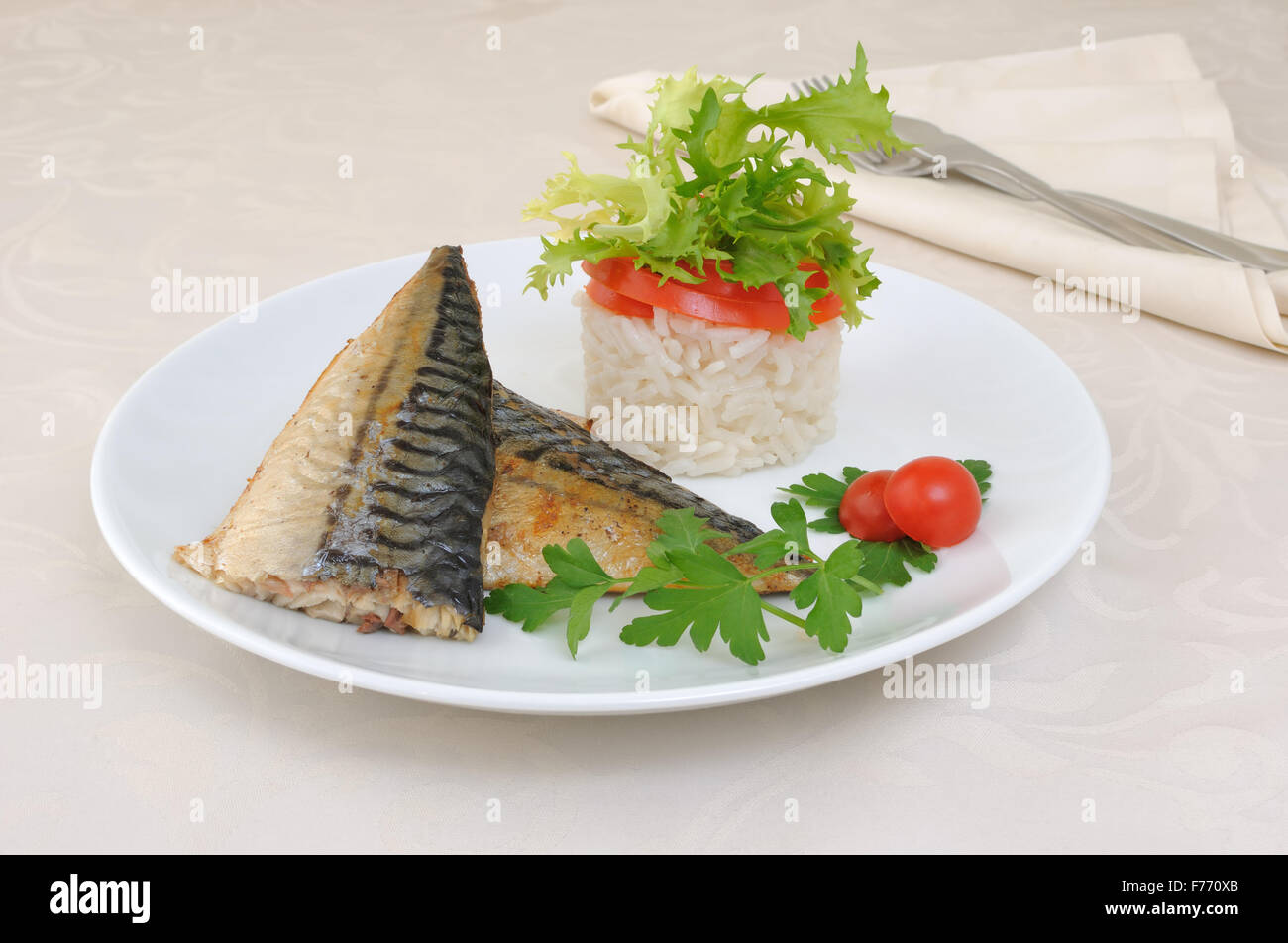 Baked mackerel with rice under vegetables Stock Photo Alamy