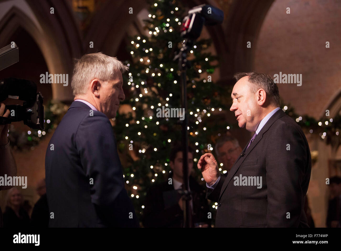 Edinburgh, UK. 26th November, 2015. A portrait of the RT Hon Alex Salmond MP MSP display on show at the Scottish National Portrait Gallery this week. The portrait was part of a group of fourteen works painted by Gerard M Burns. Pictured member of the media and Alex Salmond. Pako Mera/Alamy Live News. Stock Photo