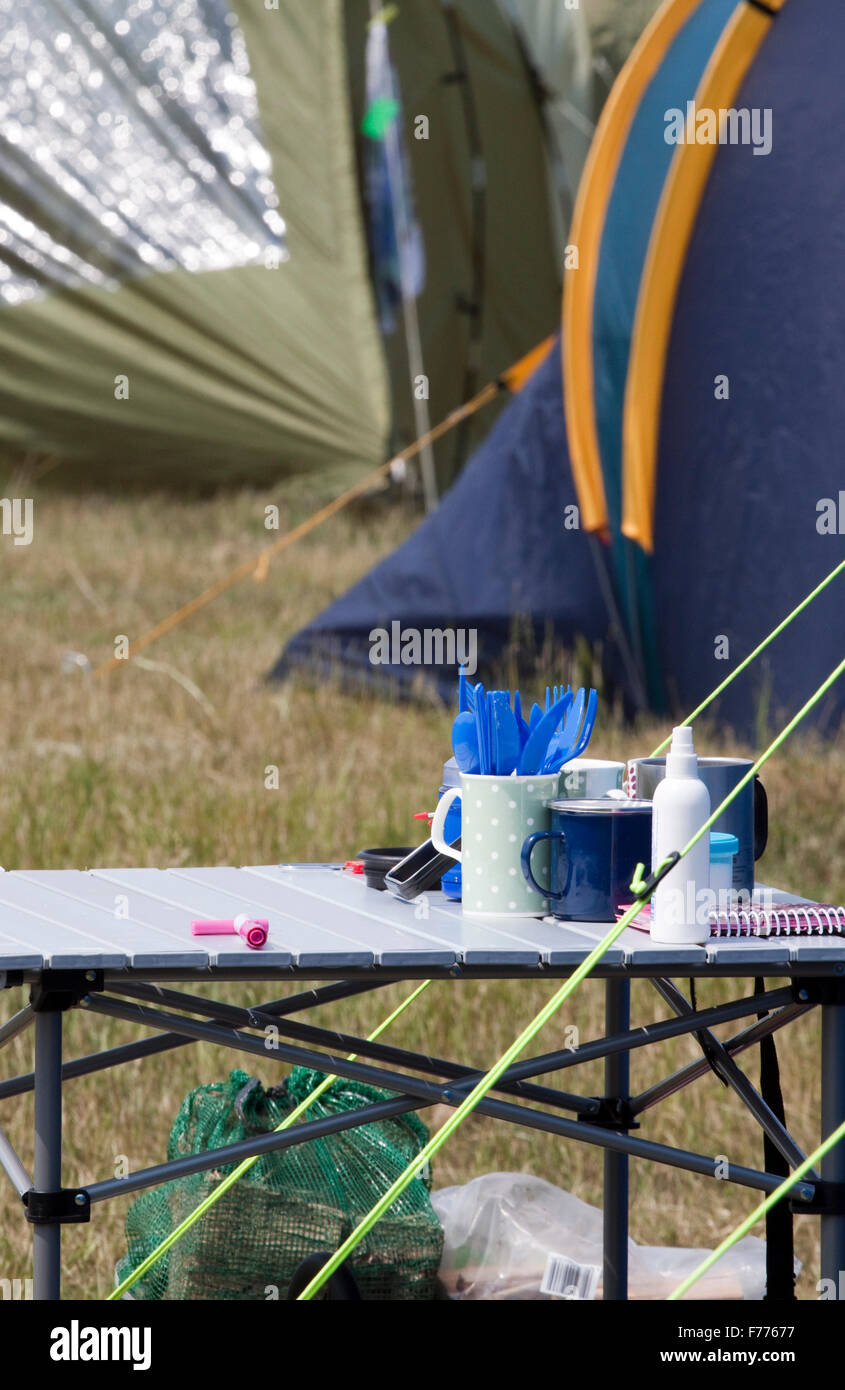 Camping table laid out with plastic cutlery Stock Photo Alamy