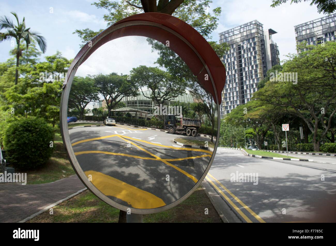 A concave mirror in accidental prone area of the road for traffic safety Stock Photo