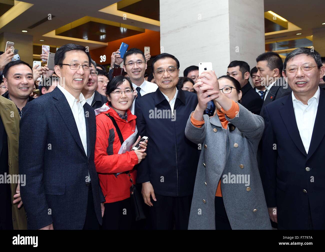 Beijing, China. 25th Nov, 2015. Chinese Premier Li Keqiang (3rd R front) visits an administrative service center in Lujiazui Area in Shanghai, east China, Nov. 25, 2015. Li had an inspection tour in the Shanghai Free Trade Zone (FTZ) on Wednesday. © Rao Aimin/Xinhua/Alamy Live News Stock Photo