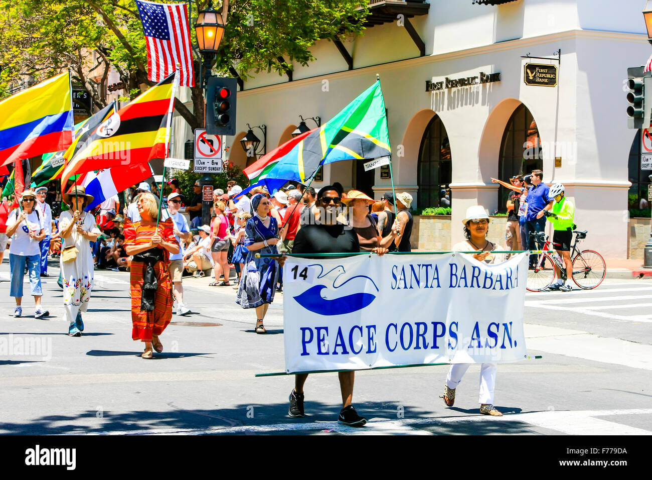 Members of the Santa Barbara Peace Corp carrying flags of the World at