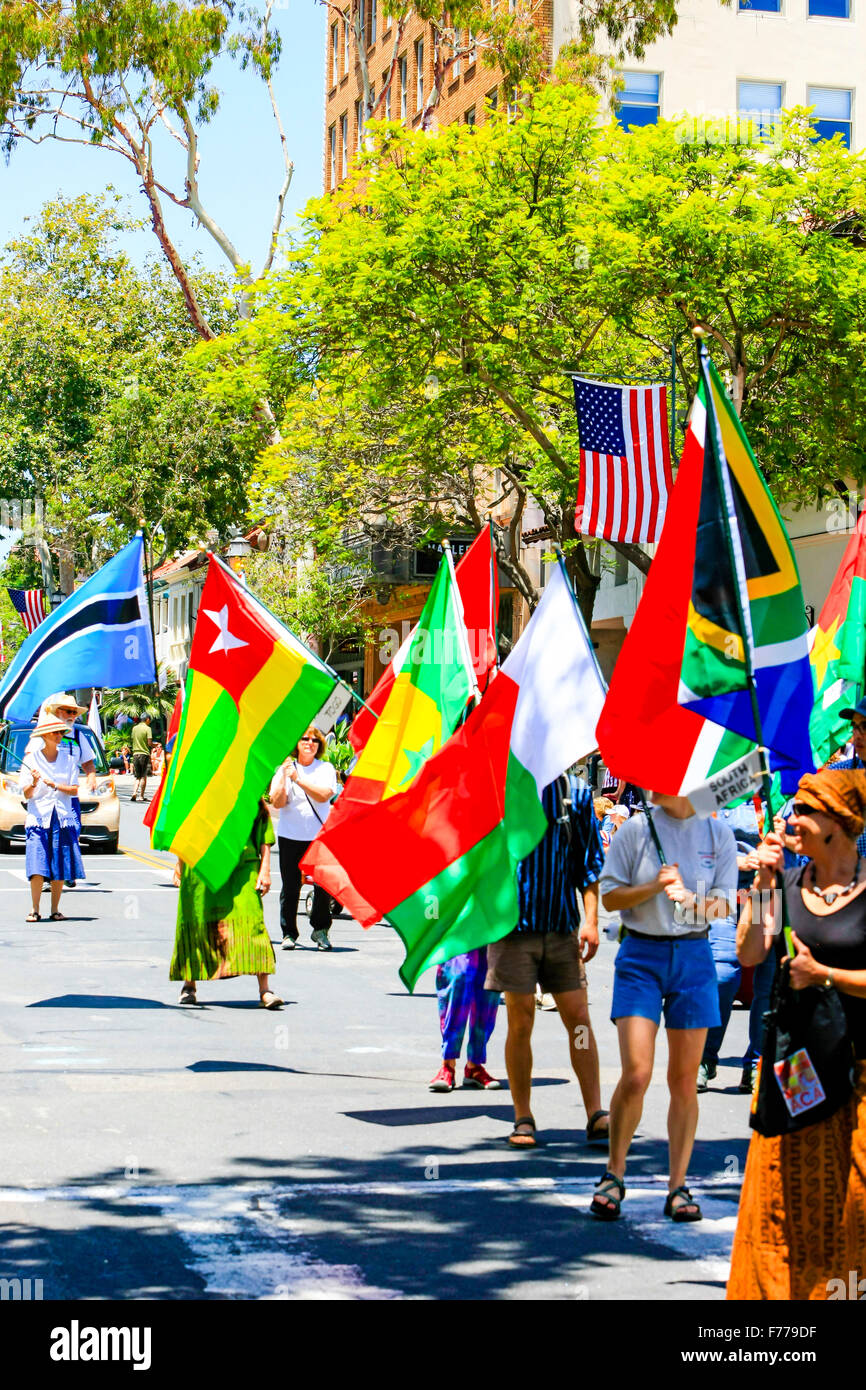 Members of the Santa Barbara Peace Corp carrying flags of the World at