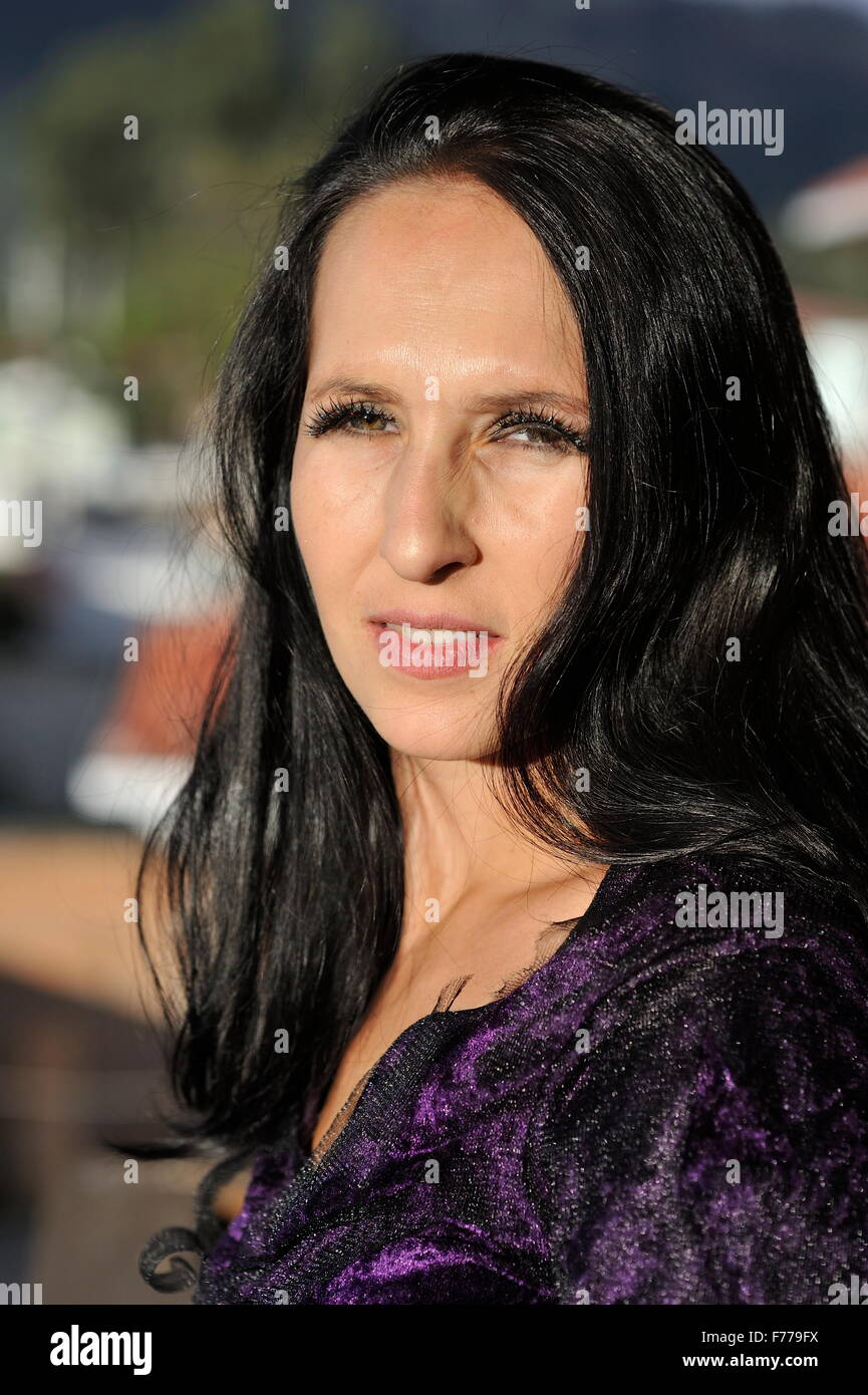 Woman dressed in purple dress Stock Photo - Alamy