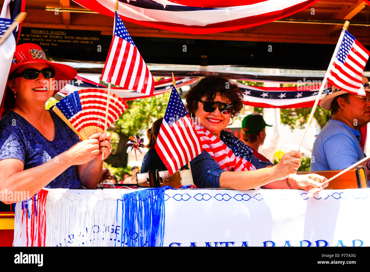 Daughters of the Revolution wave flags at the July 4th celebration