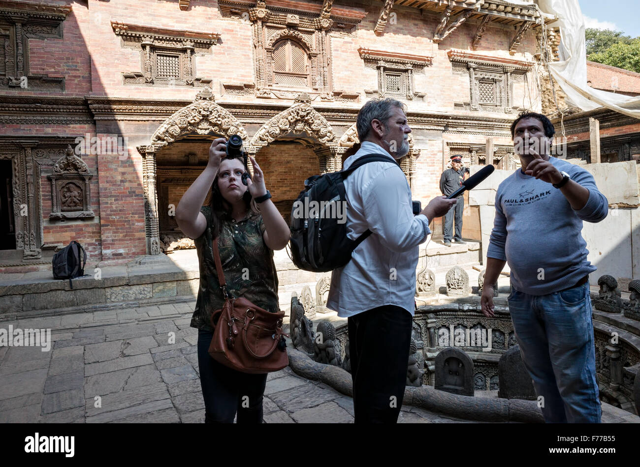tourists, reporters and their guide at work, Sundari Chowk, Patan Durbar Square, 2015, Nepal Stock Photo