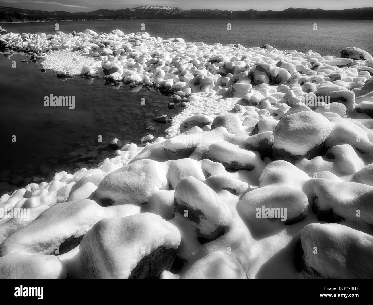New snow on shore of Lake Tahoe, California Stock Photo